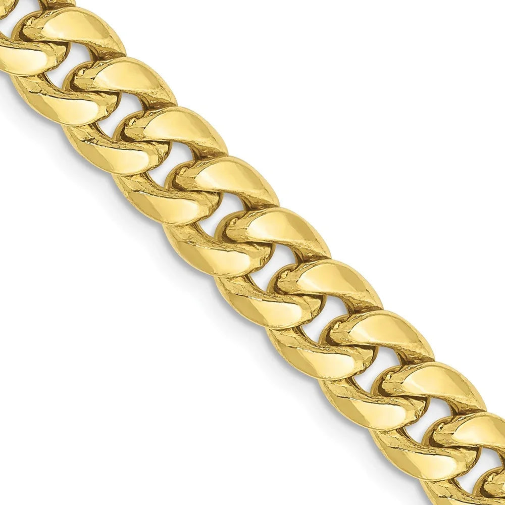 6.75mm bold statement Cuban link chain crafted in 10K Yellow Gold, solid gold construction, close-up studio shot.