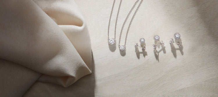 Lab-grown diamond studs, drops and pendants on ivory linen – Picasso Gold & Diamond Chicago