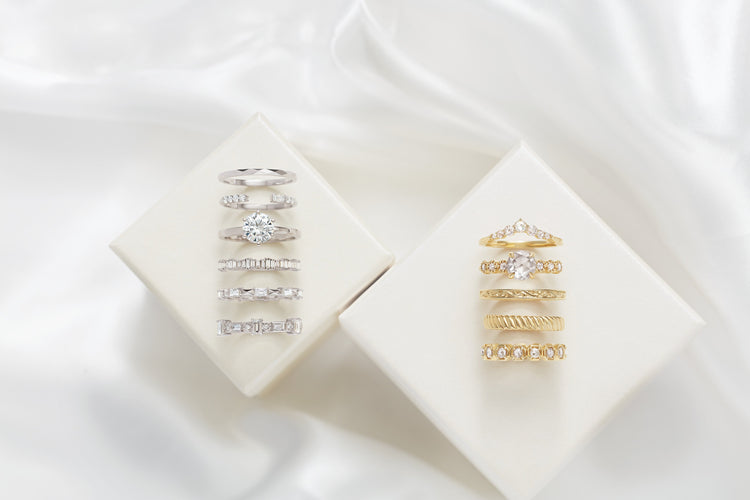 White and yellow gold diamond eternity bands on ivory – Picasso Gold & Diamond Chicago