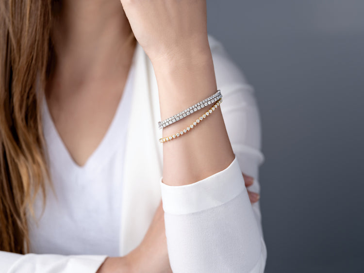 Diamond line bracelets on wrist with white shirt – Picasso Gold & Diamond Chicago