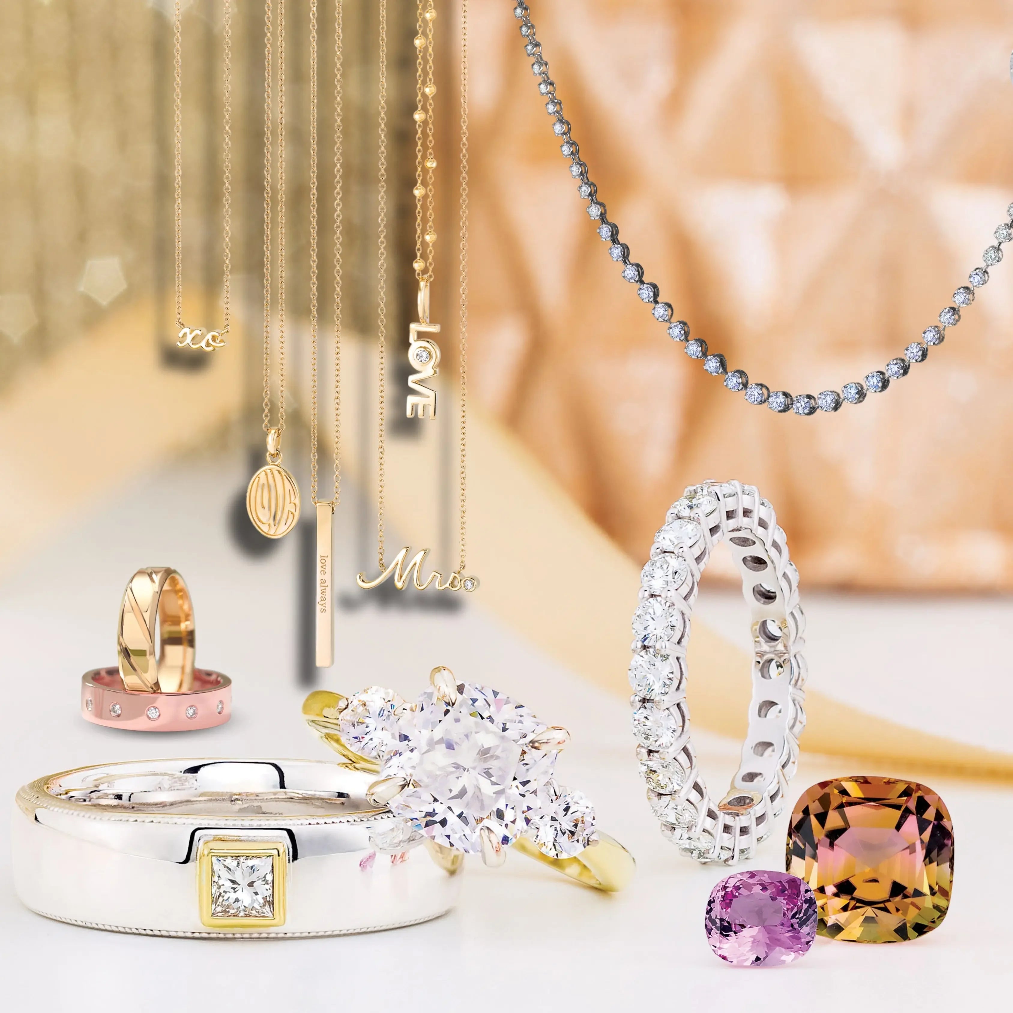 Assorted gold and diamond rings, necklaces, and gemstones displayed on a luxury background.