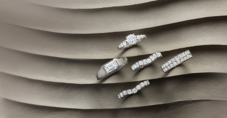 Lab-grown diamond wedding bands on sculpted sand – Picasso Gold & Diamond Chicago