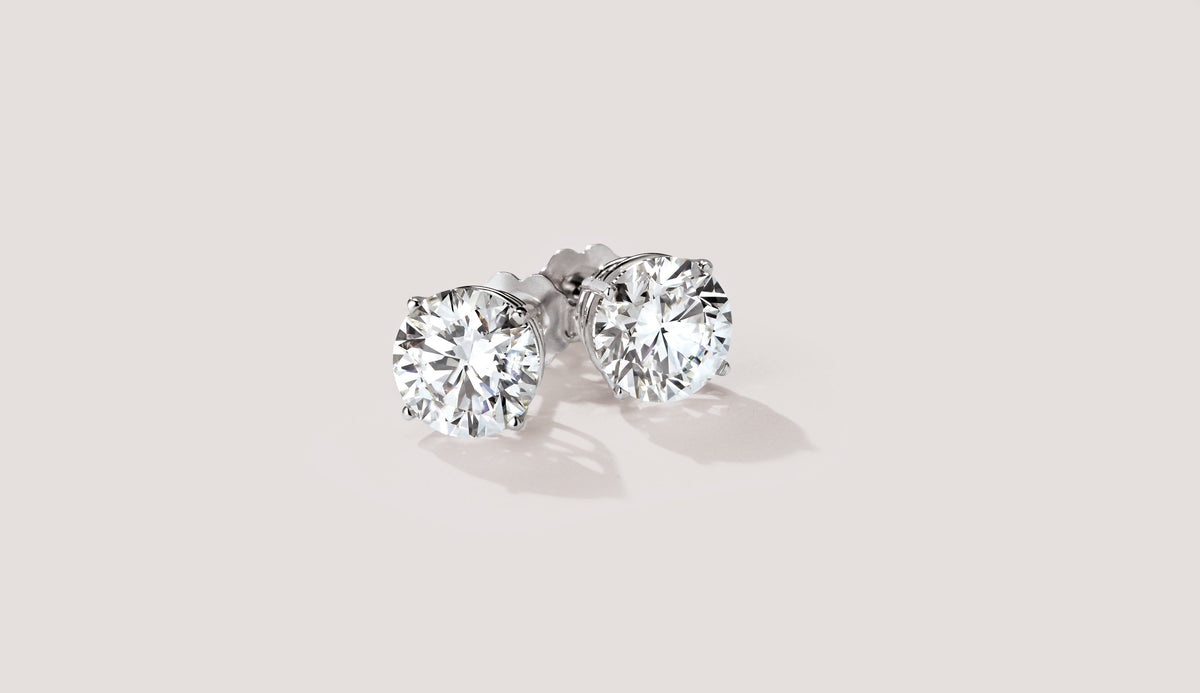 Round diamond stud earrings in white gold – Picasso Gold & Diamond Chicago