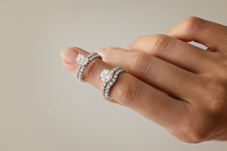 Diamond engagement ring and pavé wedding band stack worn on hand – Picasso Gold & Diamond Chicago