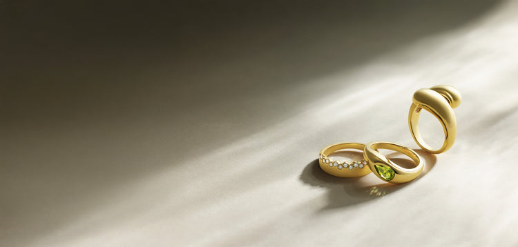Sculptural 14K gold rings in raking light – Picasso Gold & Diamond Chicago