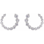 Side view of 14K white gold lab-grown diamond front-back earrings with a sleek, modern design