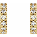Side view of 14K yellow gold huggie earrings showcasing polished finish and secure friction backs