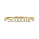 Handcrafted 14k Yellow Gold diamond bangle, showcasing 1.05 CTW lab grown diamond, in a round cut, close-up detail shot.