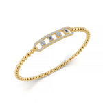 Classic 14k Yellow Gold diamond bangle, set with 1.05 CTW lab grown diamond, side profile view.