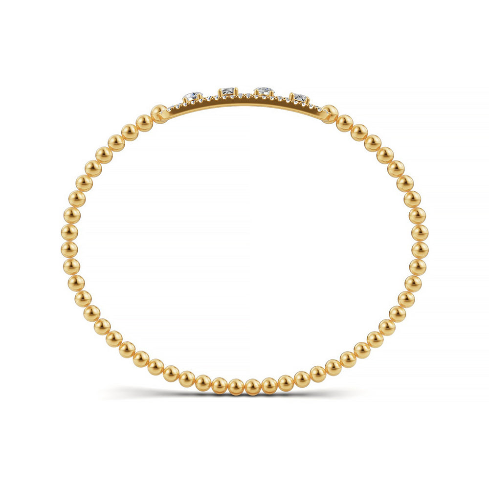Handcrafted 14k Yellow Gold diamond bangle, featuring 1.05 CTW lab grown diamond, worn lifestyle shot, Chicago fine jewelry, nationwide shipping.