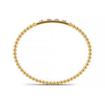 Handcrafted 14k Yellow Gold diamond bangle, featuring 1.05 CTW lab grown diamond, worn lifestyle shot, Chicago fine jewelry, nationwide shipping.