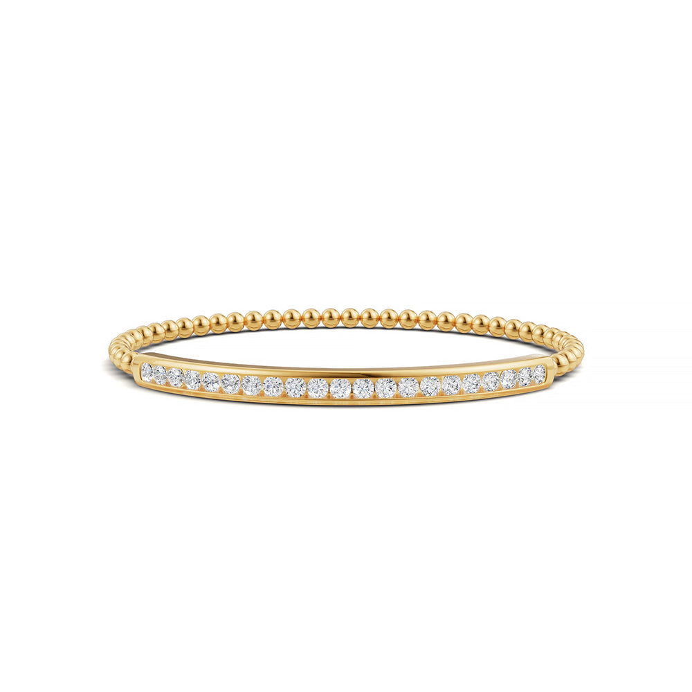 14k Yellow Gold diamond bangle, set with 1.49 CTW lab grown diamond, with round-cut stones, close-up detail shot.