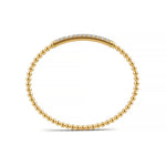 Classic 14k Yellow Gold diamond bangle, showcasing 1.33 CTW lab grown diamond, worn lifestyle shot.