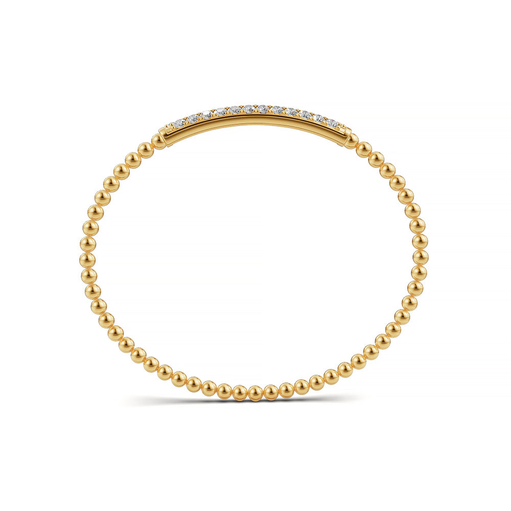 Classic 14k Yellow Gold diamond bangle, showcasing 1.33 CTW lab grown diamond, worn lifestyle shot.