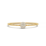 14k Yellow Gold diamond bangle, set with 1.32 CTW lab grown diamond, in a round cut, close-up detail shot.