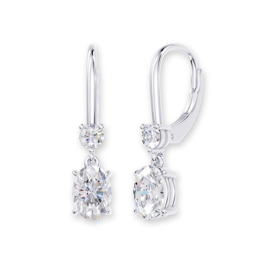Handcrafted 14k White Gold dangle earrings, set with 5 CT lab-grown diamond, with oval-cut stones, close-up detail shot.