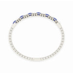 Elegant 14k White Gold diamond bangle, set with 12 CTW lab diamond / lab blue sapphire, worn lifestyle shot.
