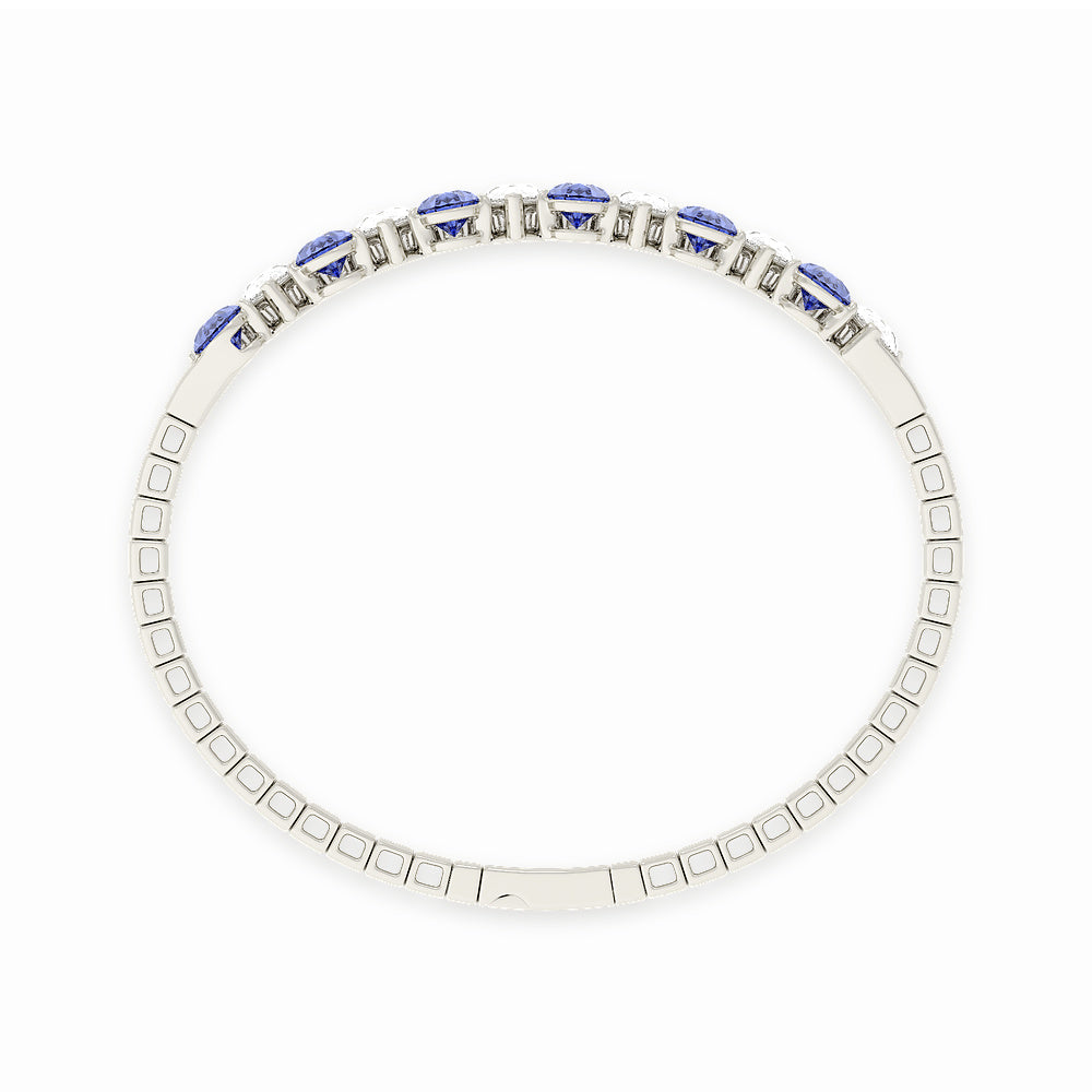 Elegant 14k White Gold diamond bangle, set with 12 CTW lab diamond / lab blue sapphire, worn lifestyle shot.