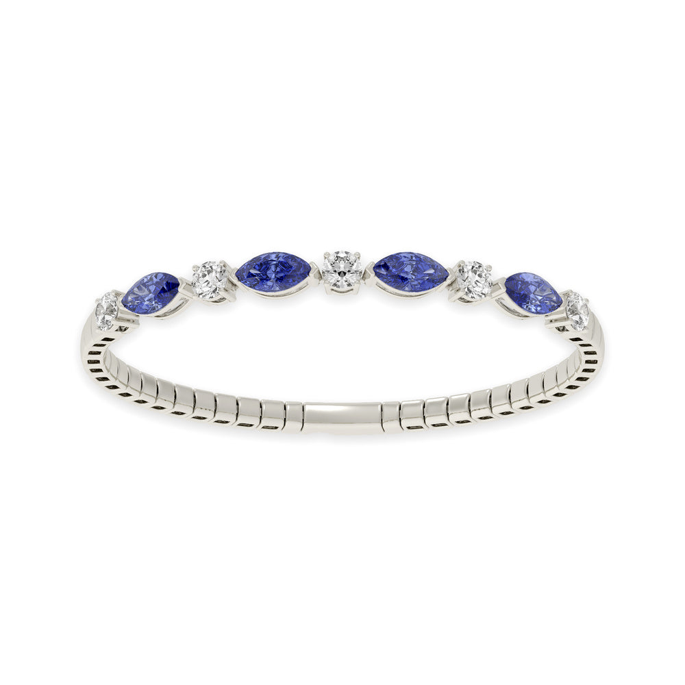Elegant 14k White Gold diamond bangle, featuring 6.5 CTW lab diamond / lab blue sapphire, in a round / marquise cut, close-up detail shot.