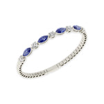 14k White Gold diamond bangle, featuring 6.5 CTW lab diamond / lab blue sapphire, worn lifestyle shot.