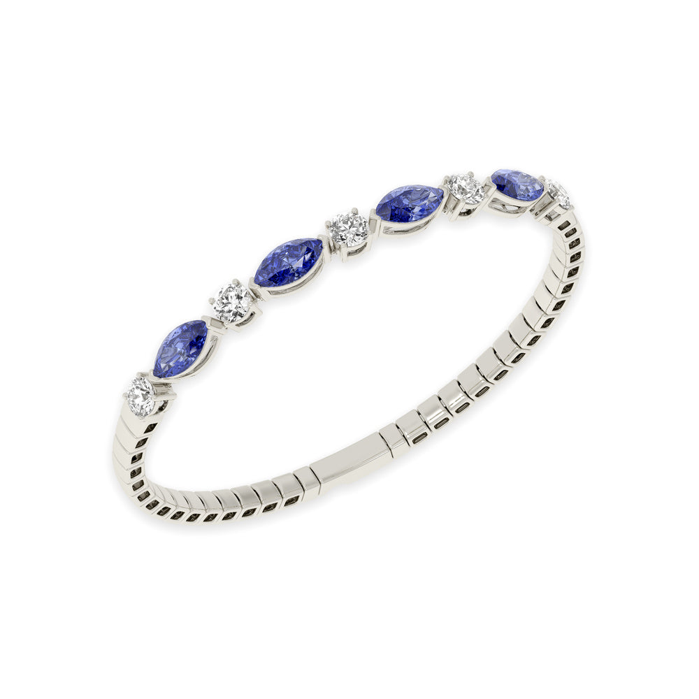 14k White Gold diamond bangle, featuring 6.5 CTW lab diamond / lab blue sapphire, worn lifestyle shot.