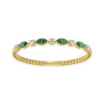 Elegant 14k Yellow Gold diamond bangle, featuring 6.5 CTW lab diamond / lab emerald, with round / marquise-cut stones, close-up detail shot.