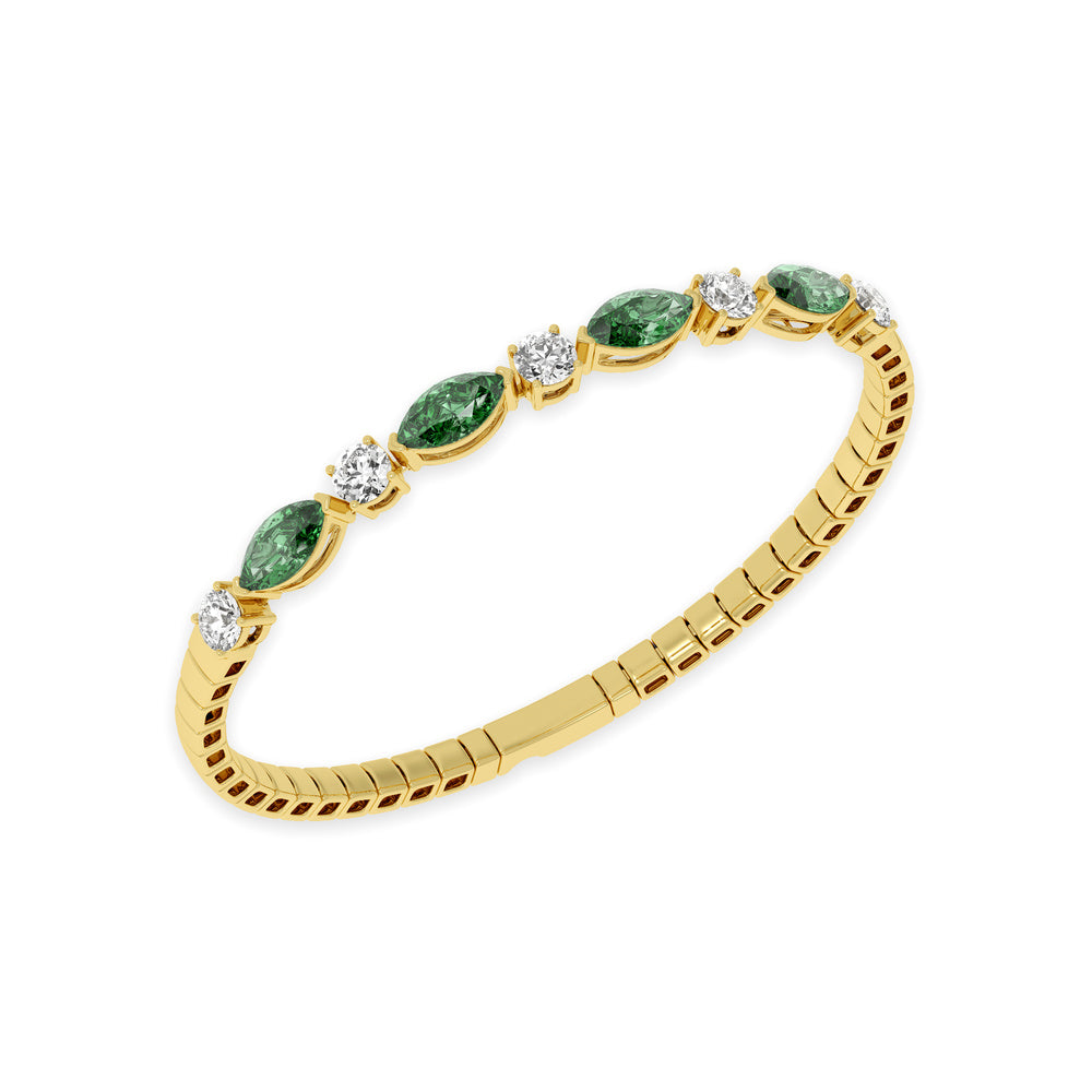 Classic 14k Yellow Gold diamond bangle, featuring 6.5 CTW lab diamond / lab emerald, worn lifestyle shot.