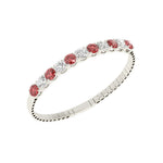 Elegant 14k White Gold diamond bangle, set with 11 CTW lab diamond / lab ruby, worn lifestyle shot.