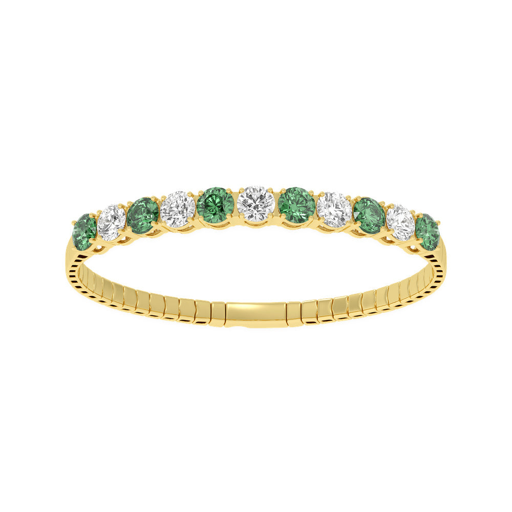 14k Yellow Gold diamond bangle, showcasing 11 CTW lab diamond / lab emerald, in a round cut, close-up detail shot.