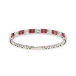Handcrafted 14k White Gold diamond bangle, featuring 11 CTW lab diamond / lab ruby, with elongated cushion-cut stones, close-up detail shot.