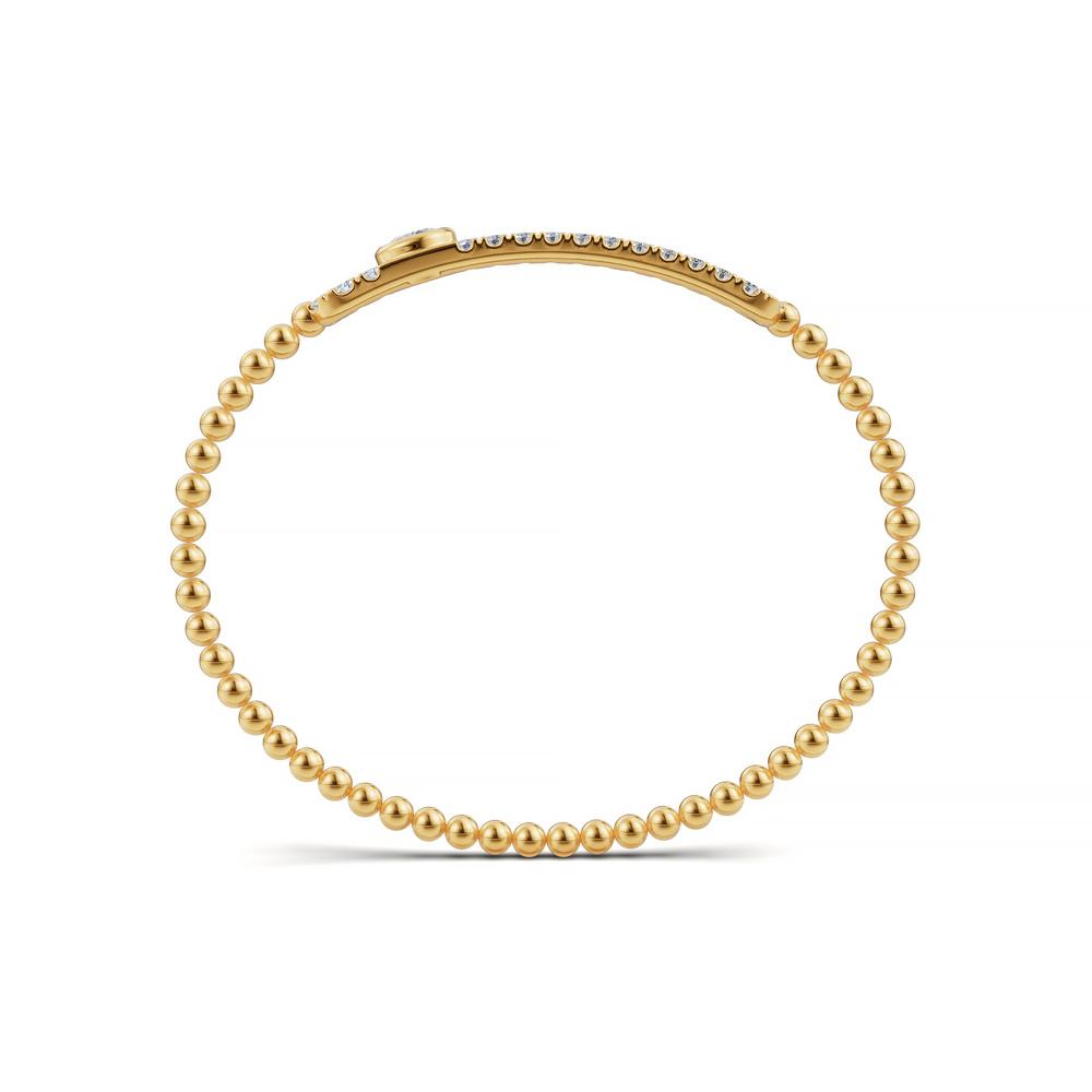 Handcrafted 14k Yellow Gold diamond bangle, featuring 2 CTW lab grown diamond, worn lifestyle shot, Chicago fine jewelry, nationwide shipping.