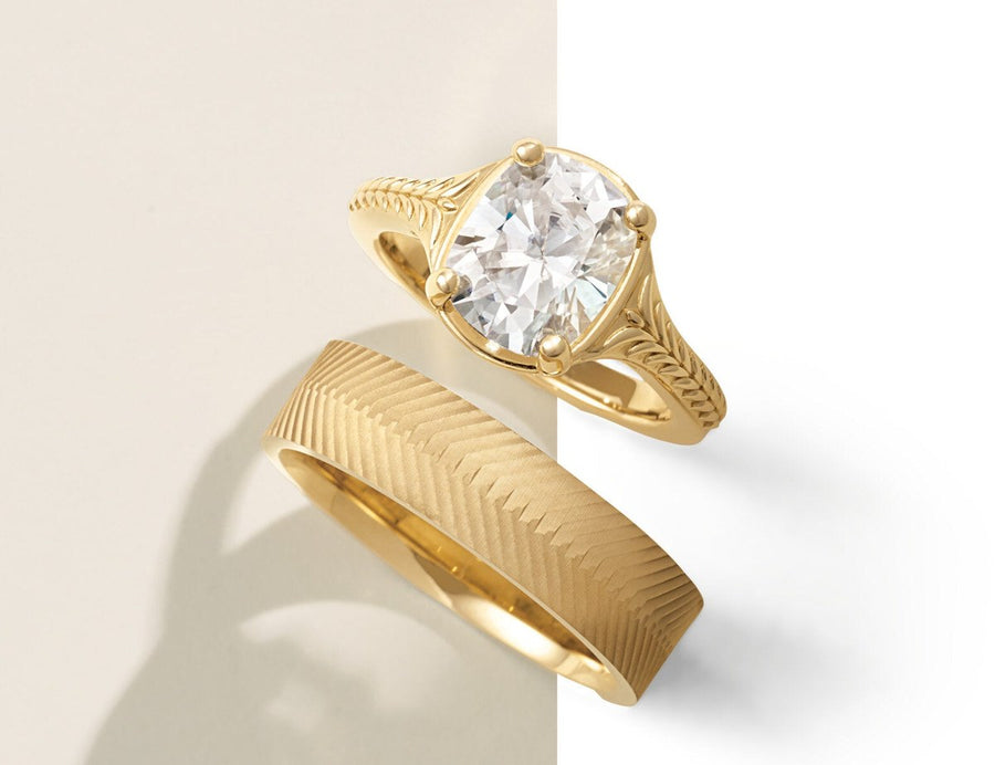 Diamond engagement ring and textured gold wedding band